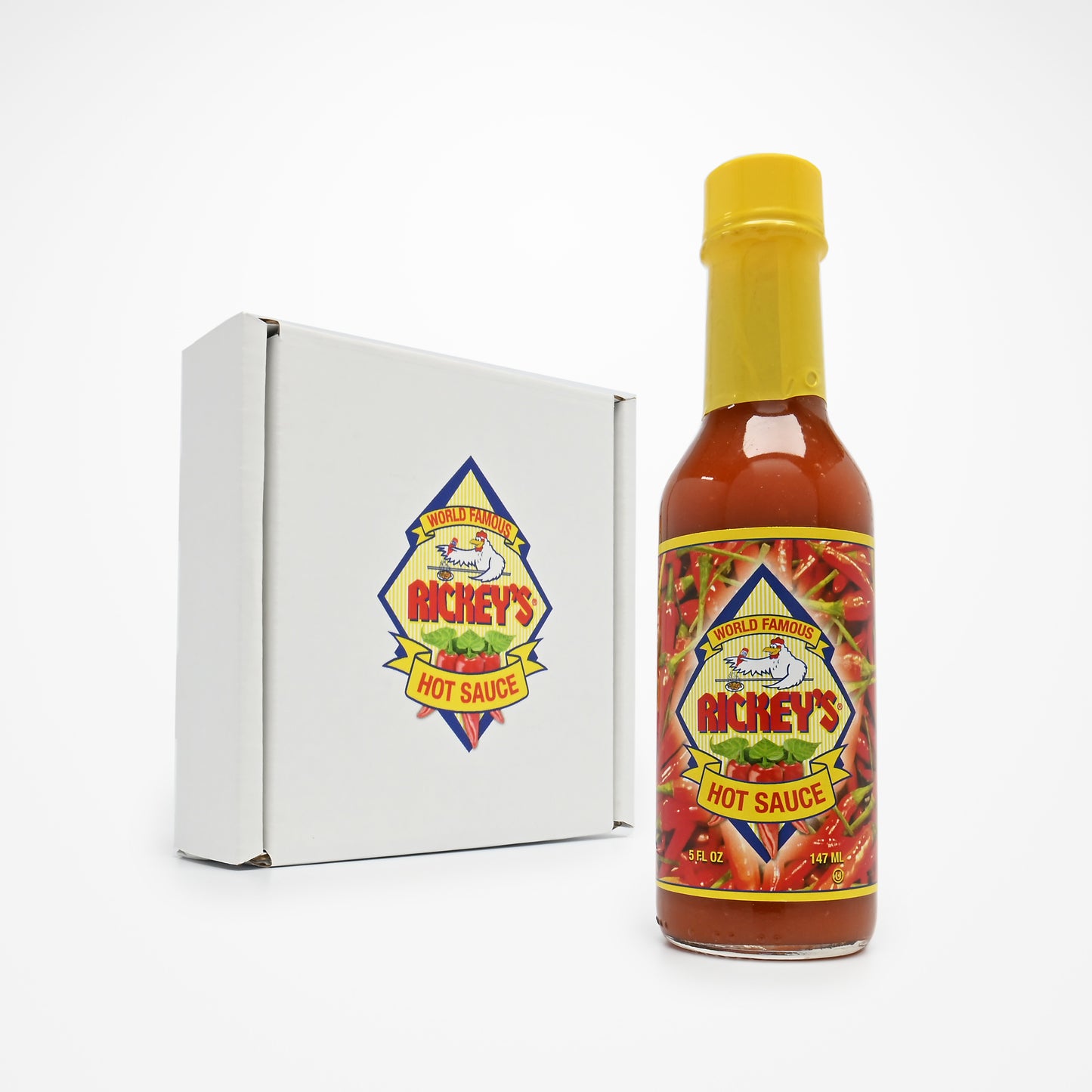 Bottle of Rickey's Hot Sauce and a box for a three pack