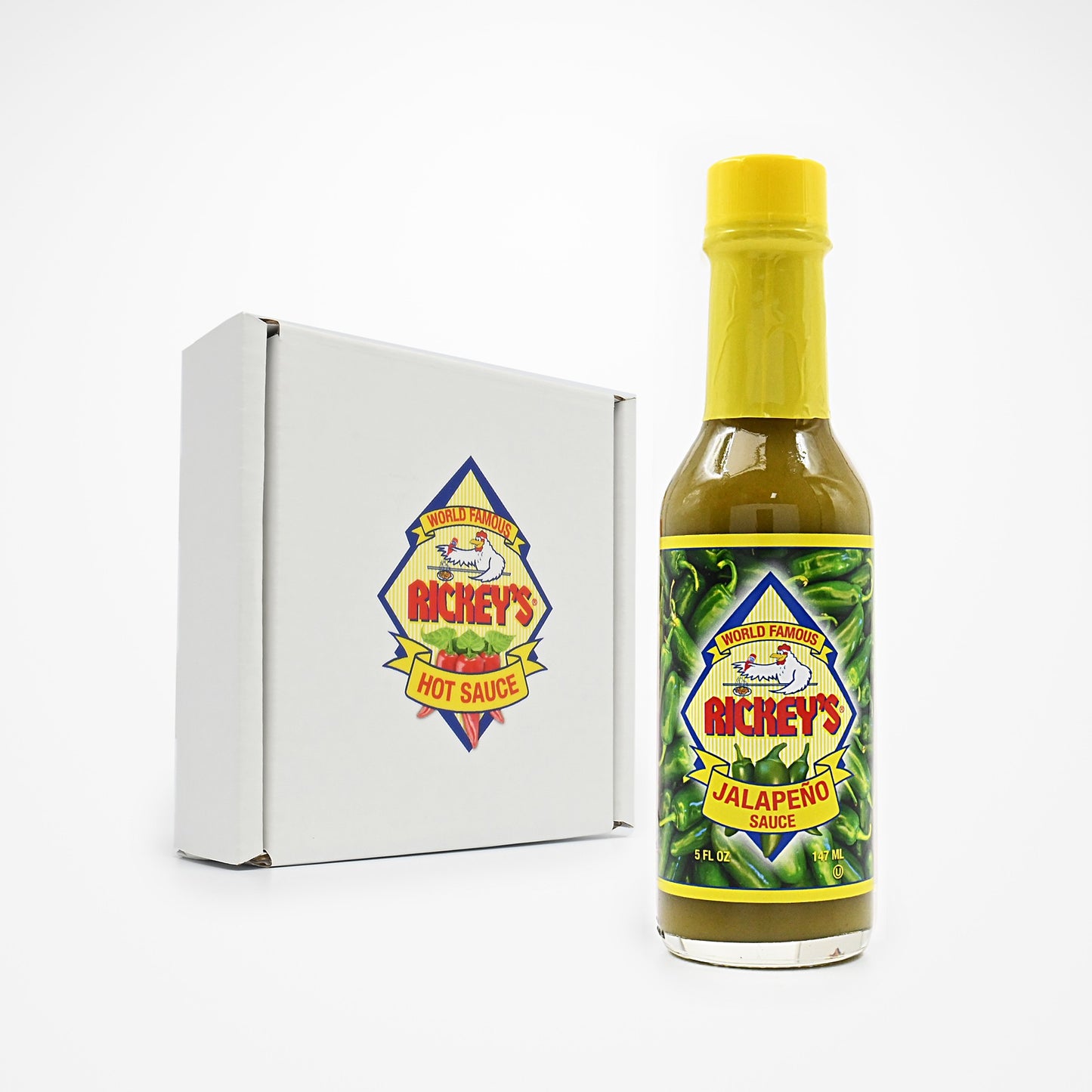 Bottle of Rickey's Jalapeño Sauce and a box for a three pack